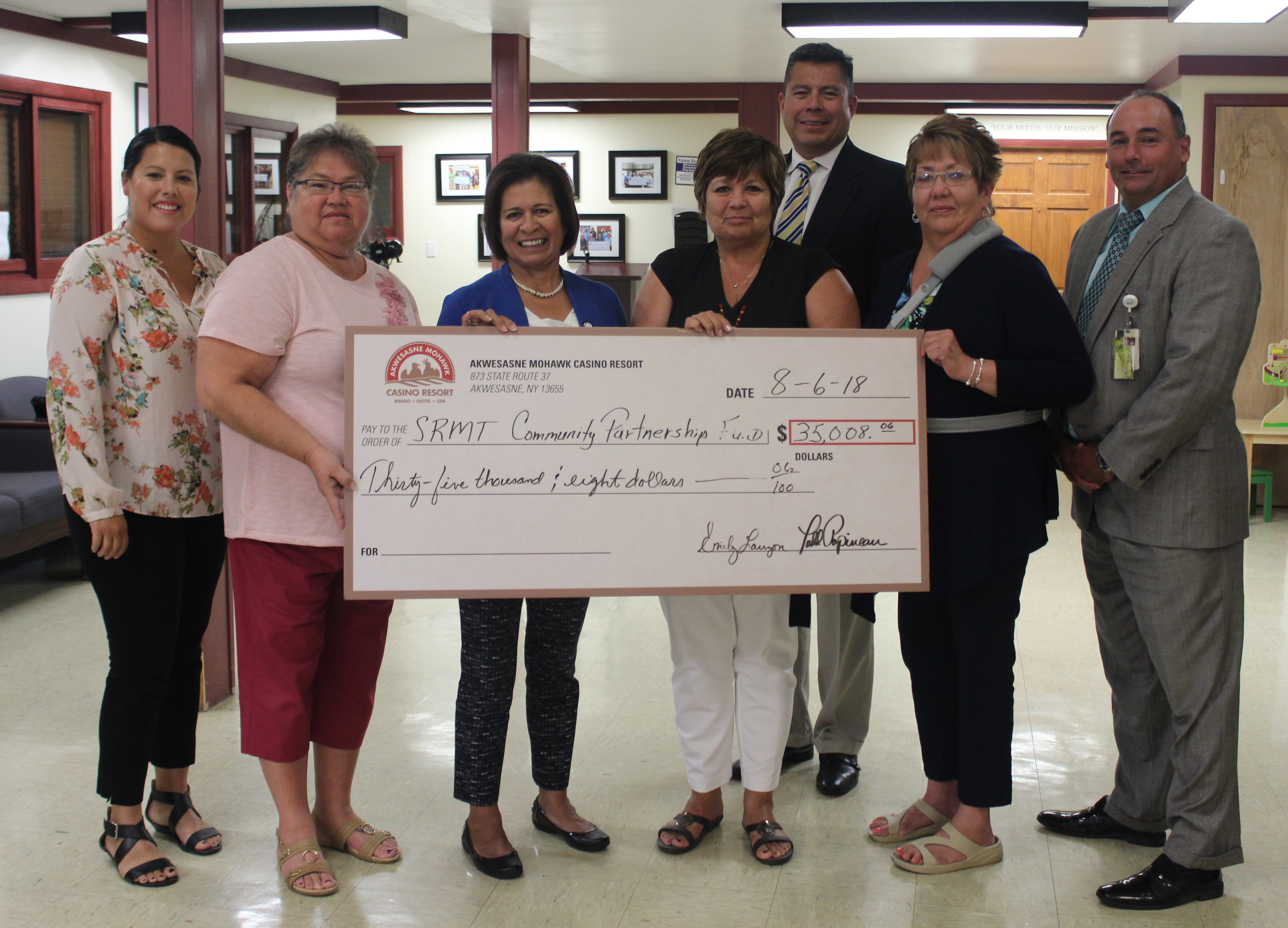 Akwesasne Mohawk Casino Resort deliver checks to recipients of their first annual golf fundraising event